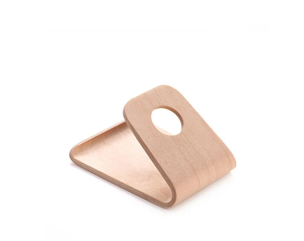 Solid wood iPhone stand in walnut finish on a desk
