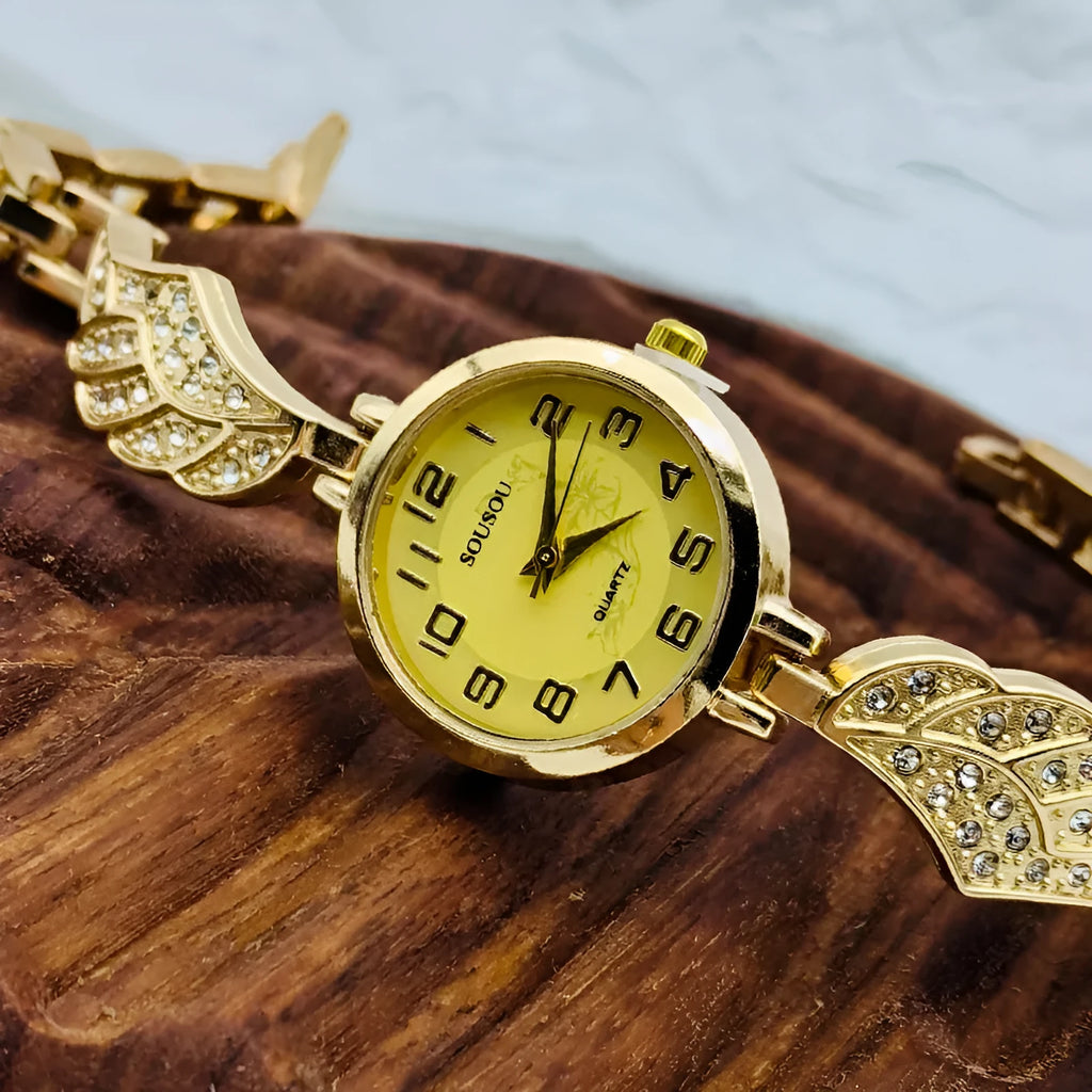 Stainless steel women's watch with round dial on a wrist, showing the Vachette clasp buckle.