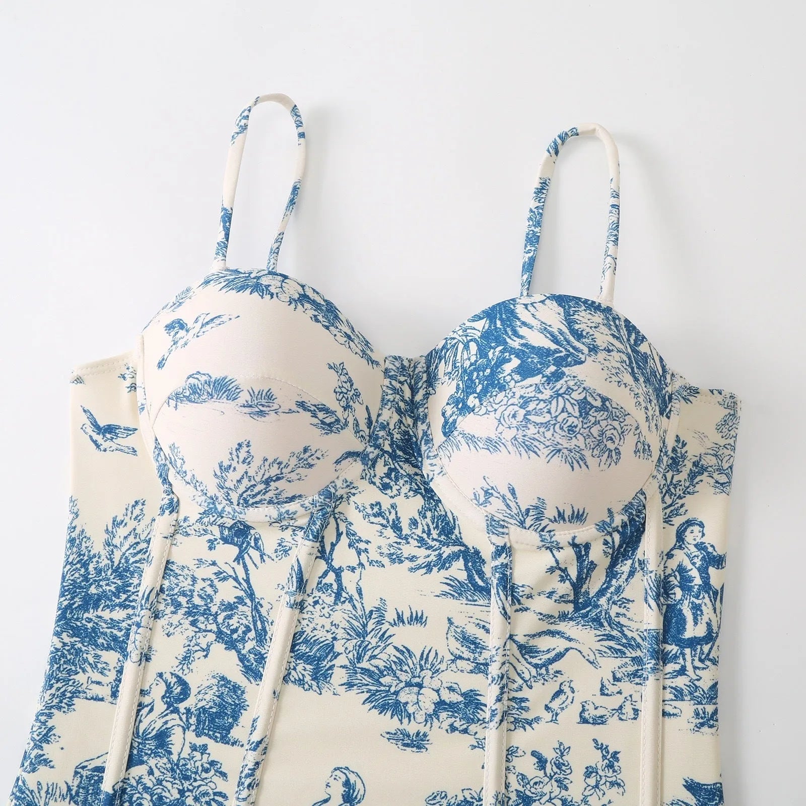 Blue patterned one-piece swimsuit for women with a matching gauze skirt