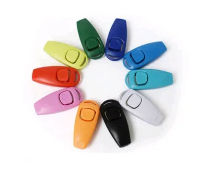 Plastic two-in-one dog training ring and whistle in black on a plain background