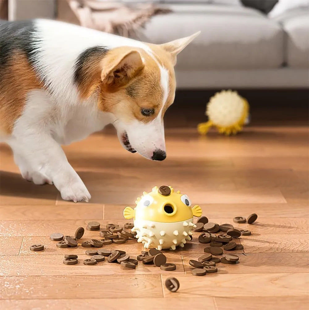 Green fish-shaped interactive dog toy with treat dispensing capability and raised surface particles
