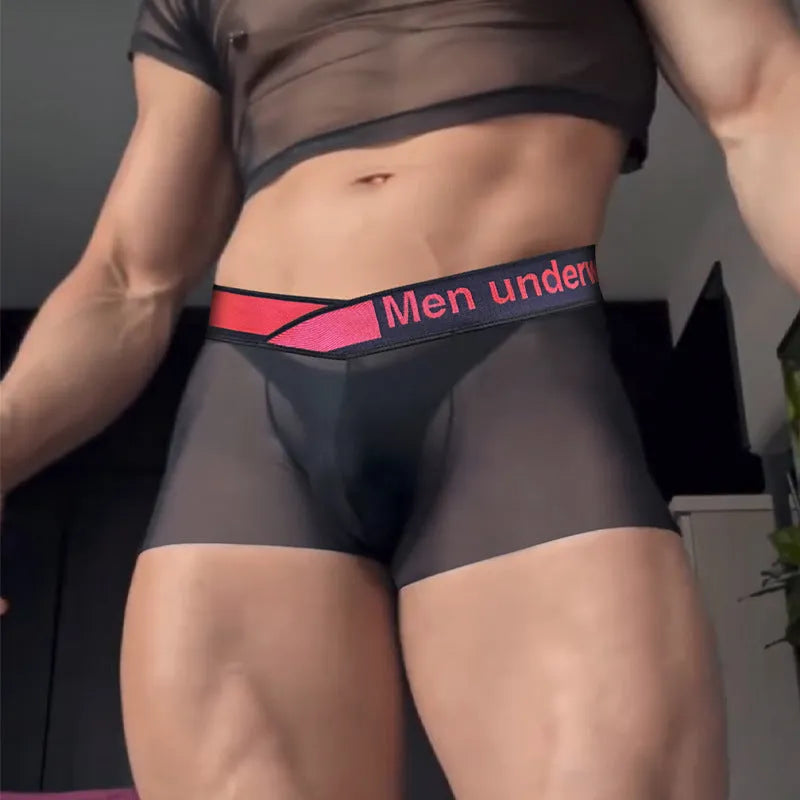Men's low waist seamless underwear in black with a red gradient laser design pattern