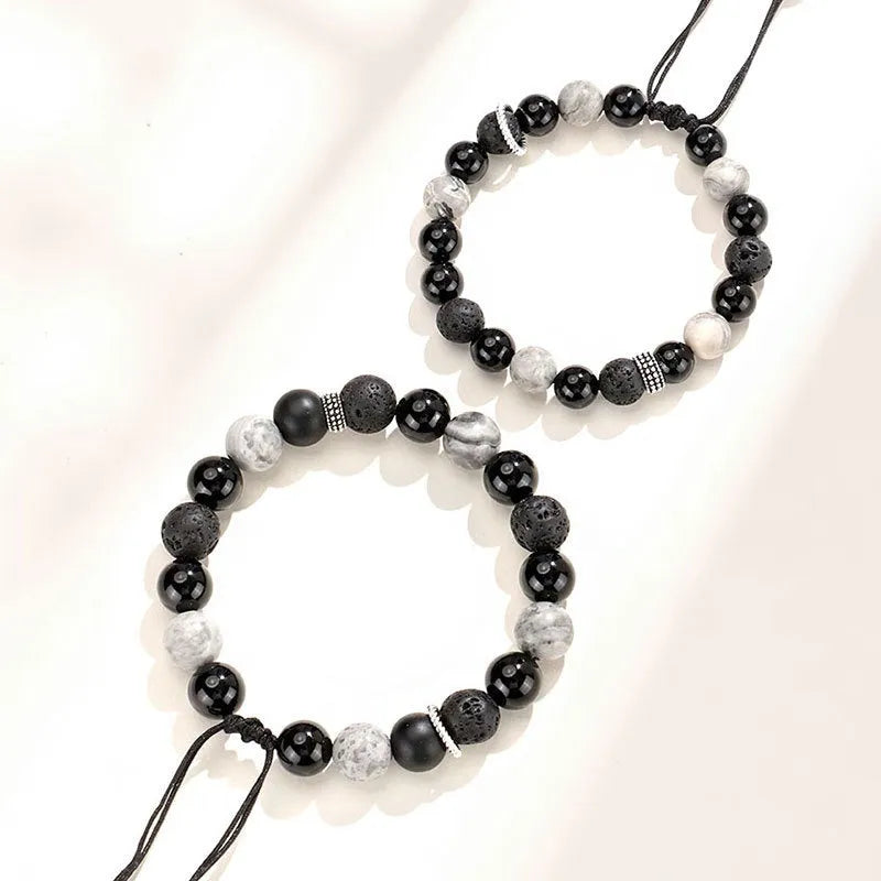 Black agate map stone volcanic rock bracelet in diamond shape, New Chinese style, on wrist.
