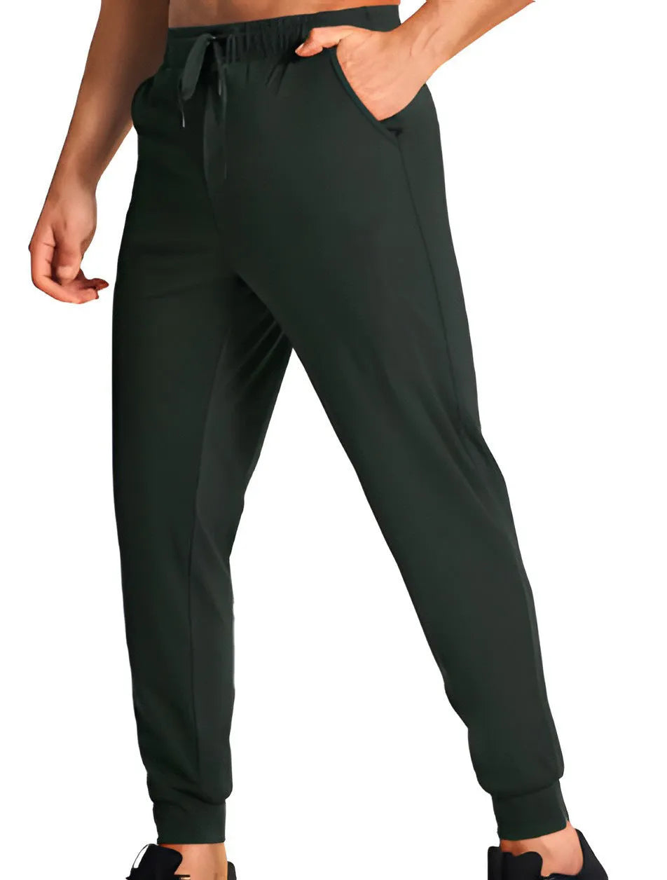 Men's loose-fit solid colour casual trousers made from polyester fabric on a hanger.