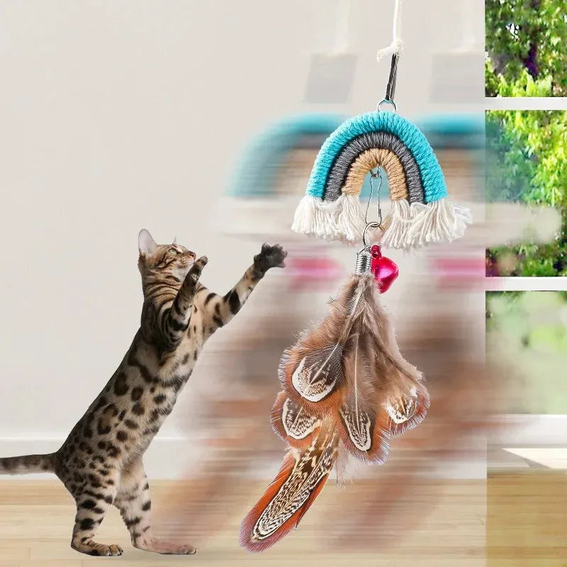 Cat door swing toy with colourful feathers on elastic cord attached by sticky buckle clamp