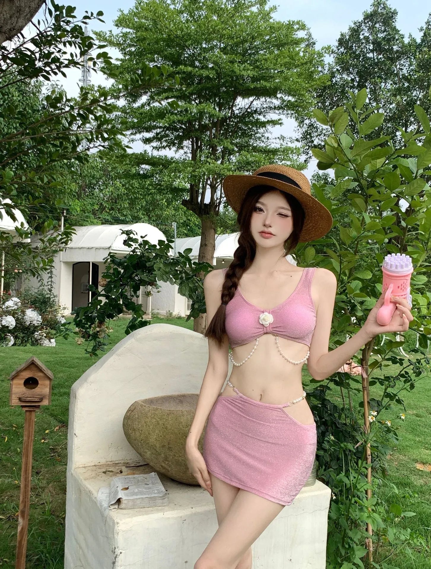 Women's three-piece bikini swimsuit in pink or black with backless briefs design