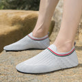 Anti-slip barefoot beach shoes for men with breathable mesh upper in solid colours