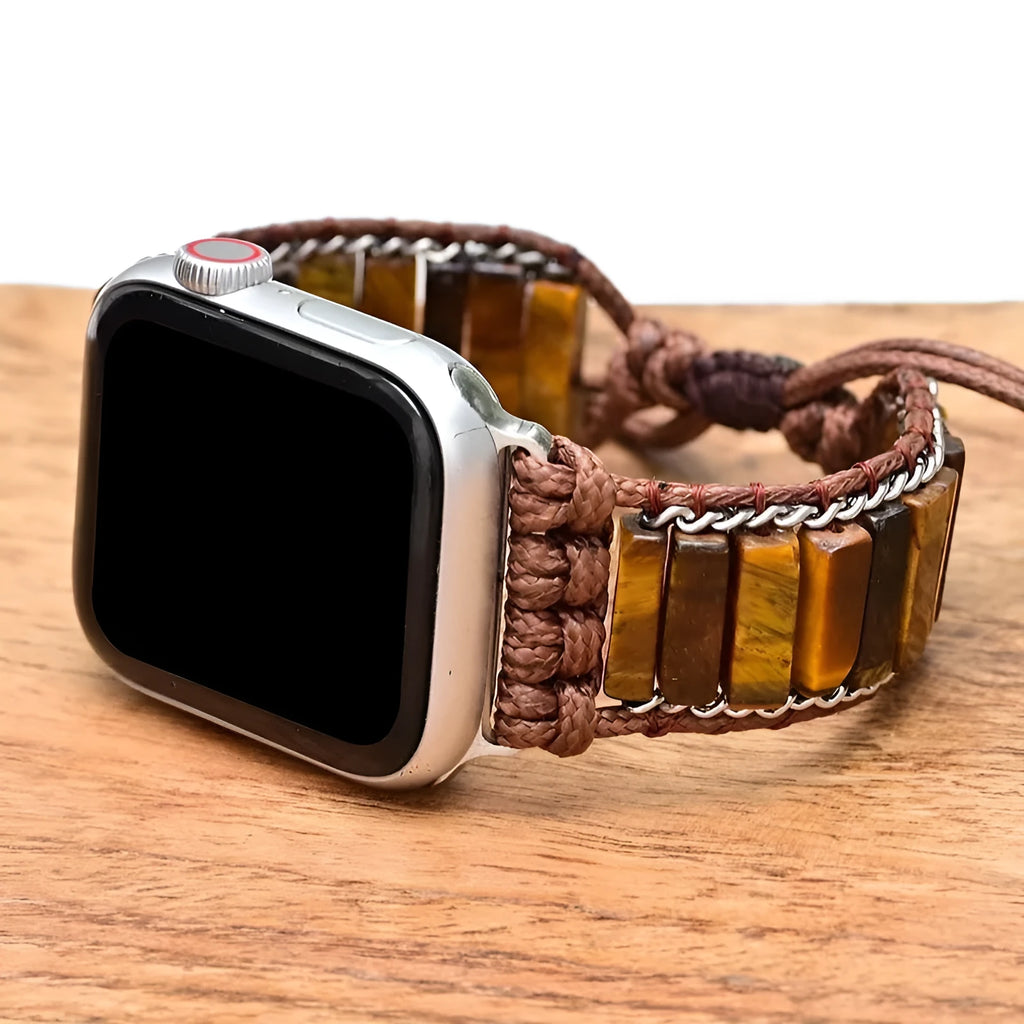 Men's adjustable textile watch strap with rectangular tiger eye stone, showing bohemian design and clasp detail.