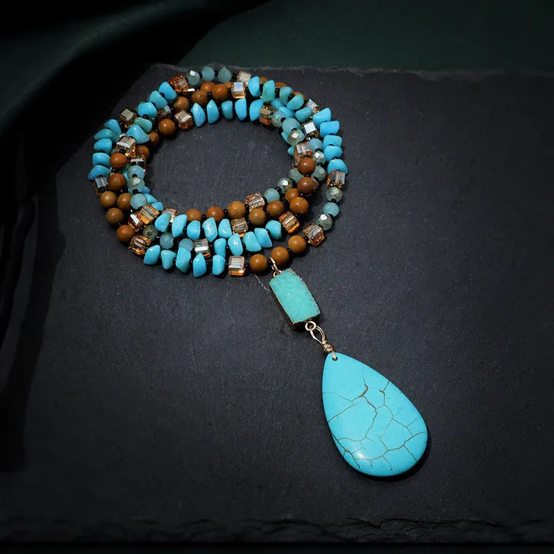 Turquoise water drop shaped pendant necklace with geometric design and ball bead chain