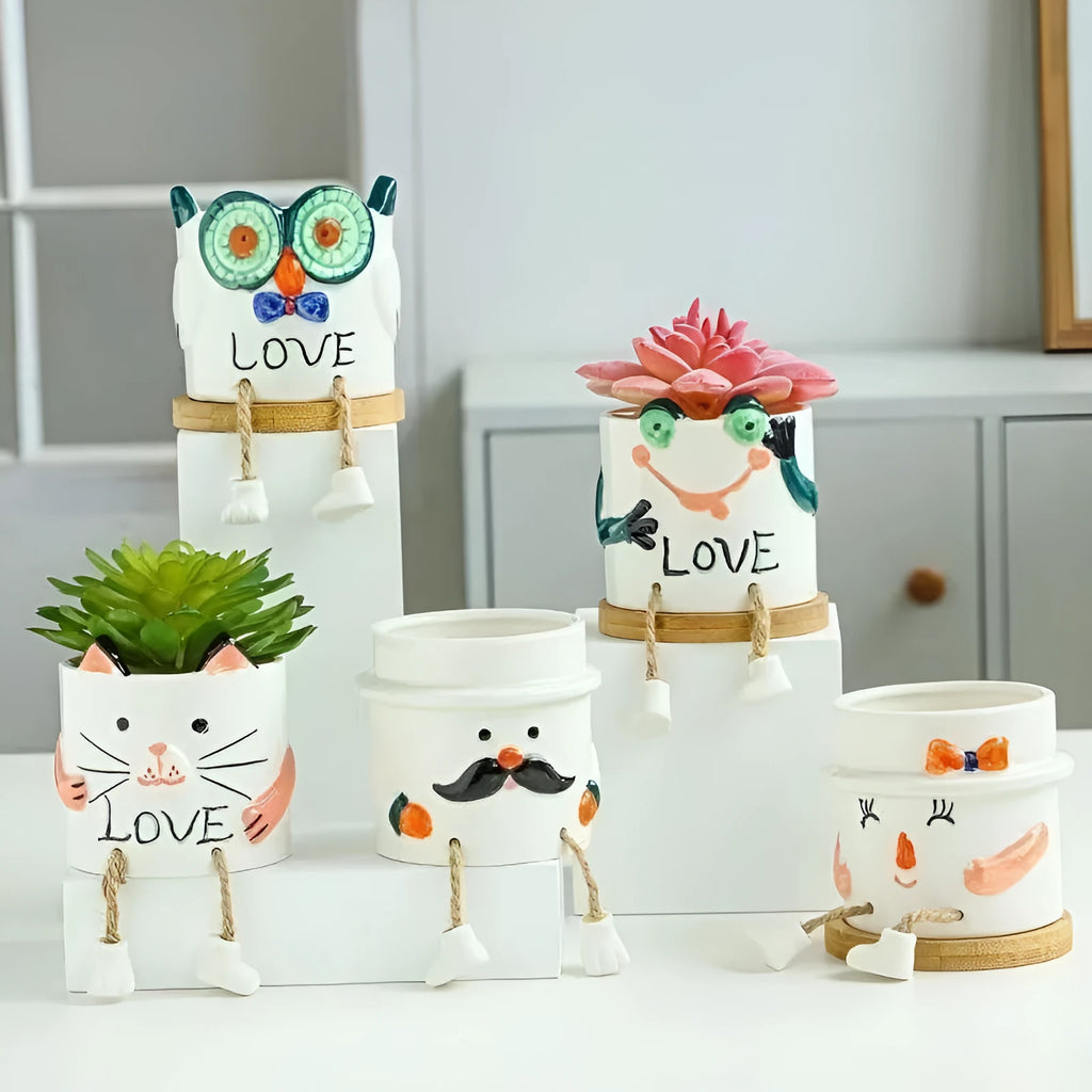 Ceramic hanging foot flowerpot with cartoon design in one of twelve colour variants for succulent plants