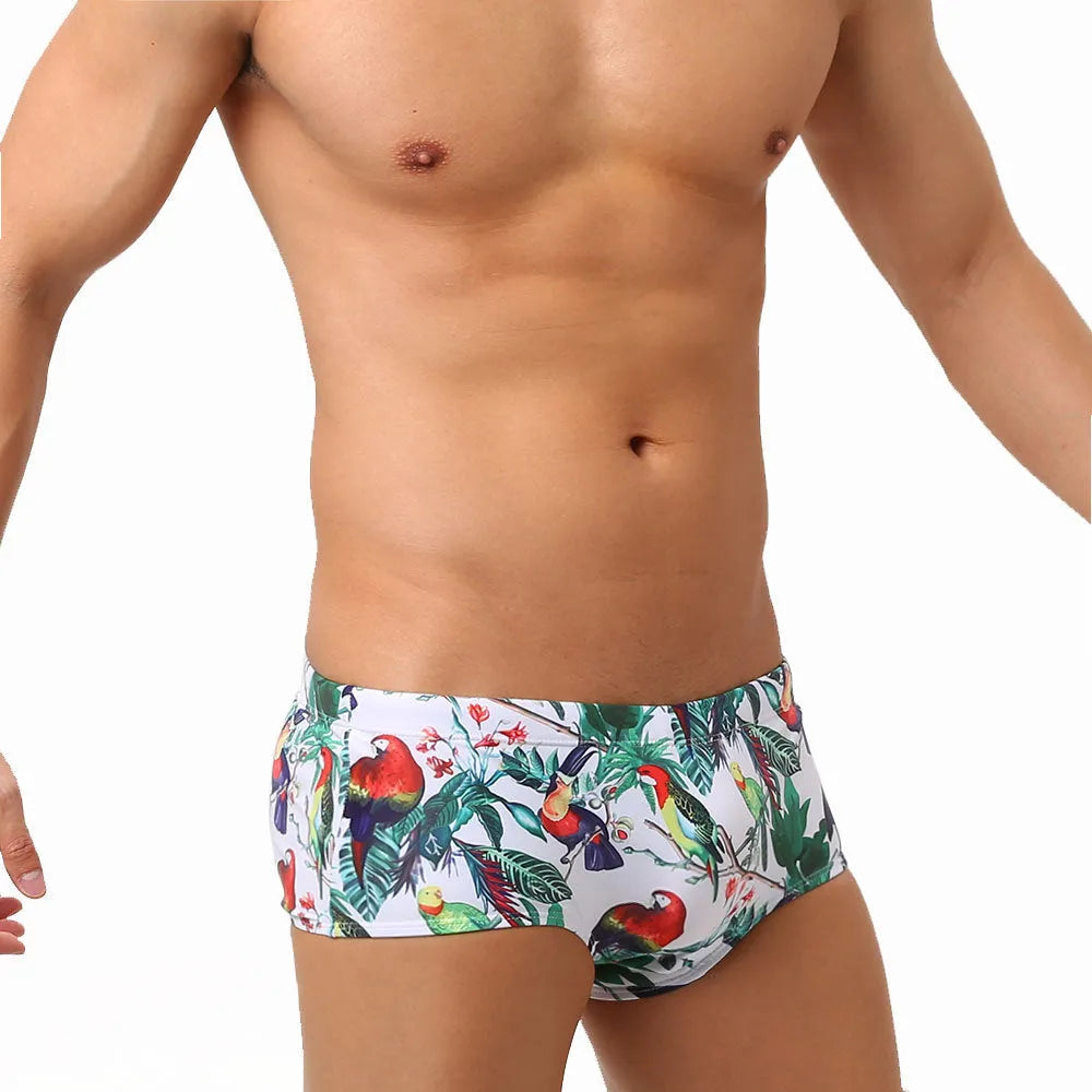 Men's floral and bird print nylon swimming trunks in boxer brief style.