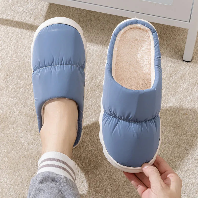 Down cotton winter slippers with artificial leather upper, thick rubber sole, and plush lining in blue colour