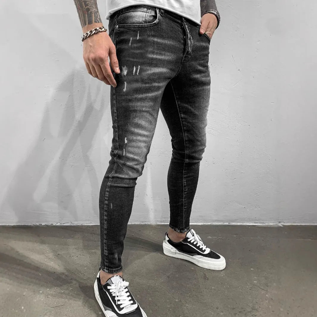 Gray ripped denim skinny pants for teenagers, cotton fabric, mid waist, zip fly, front view