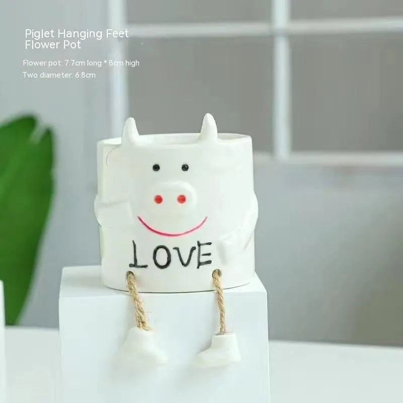 Ceramic hanging foot flowerpot with cartoon design in one of twelve colour variants for succulent plants