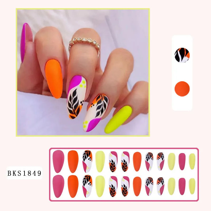 Wear Armour medium almond nail stickers in frosted French leaves, macaron, leopard print, and plating designs.