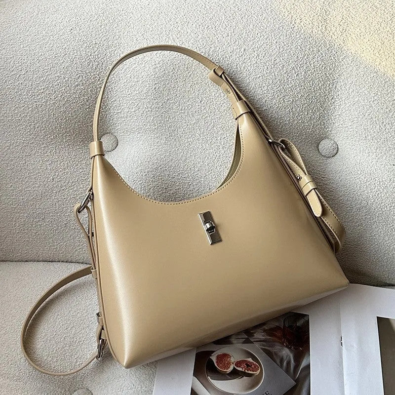 Genuine leather dumpling-shaped crossbody bag in apricot colour with an outer sandwich pocket