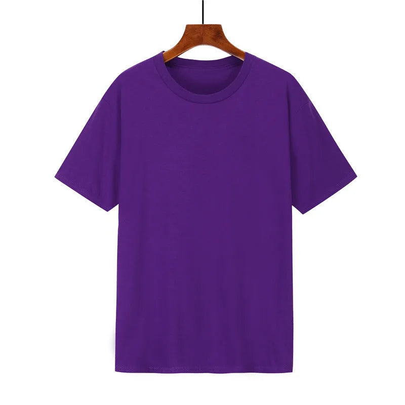 A man's loose-fitting black cotton t-shirt with short sleeves laid flat.