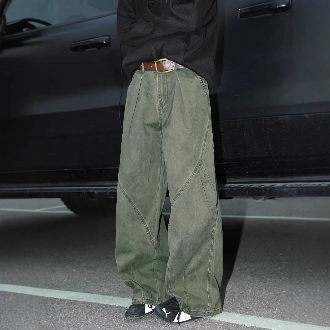 Men's pleated straight loose trousers in black striped pattern showing straight leg design