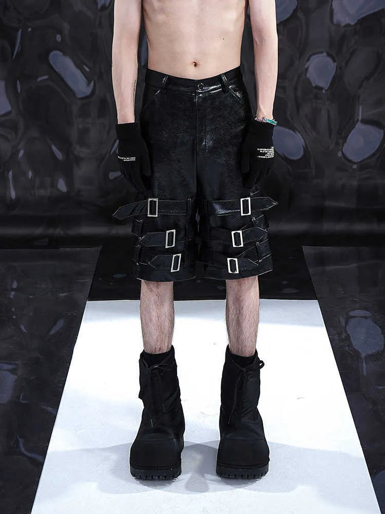 Black men's spandex leather-look shorts with a cropped, casual fit and medium-low waist.