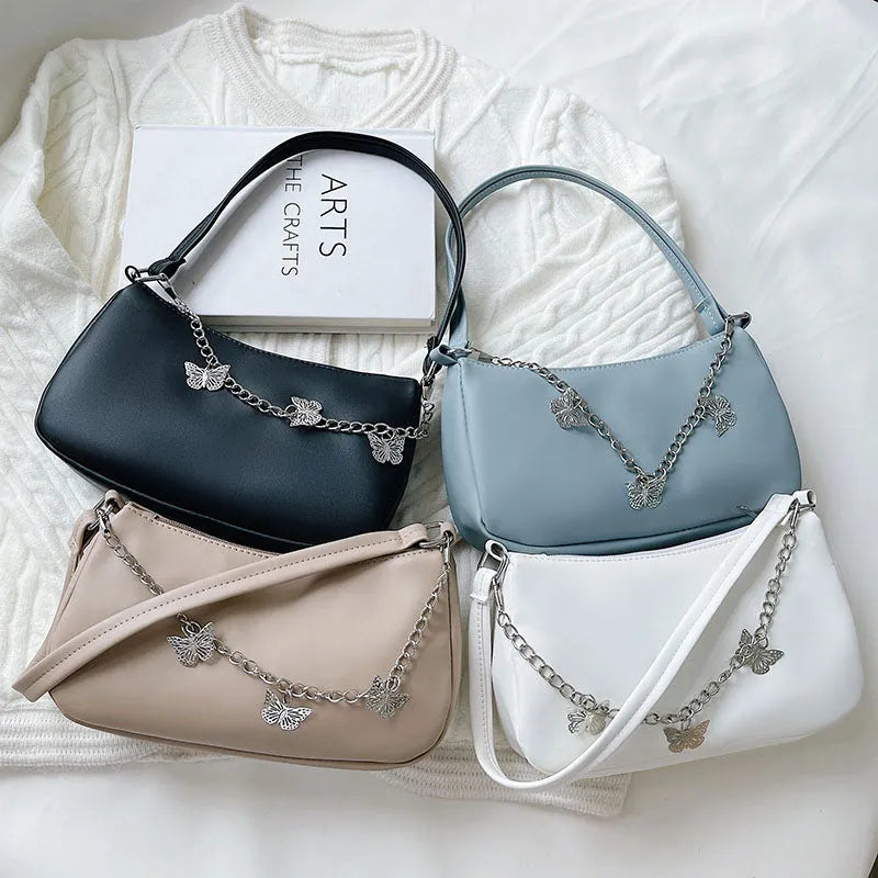 Horizontal square butterfly chain underarm bag in four colour options