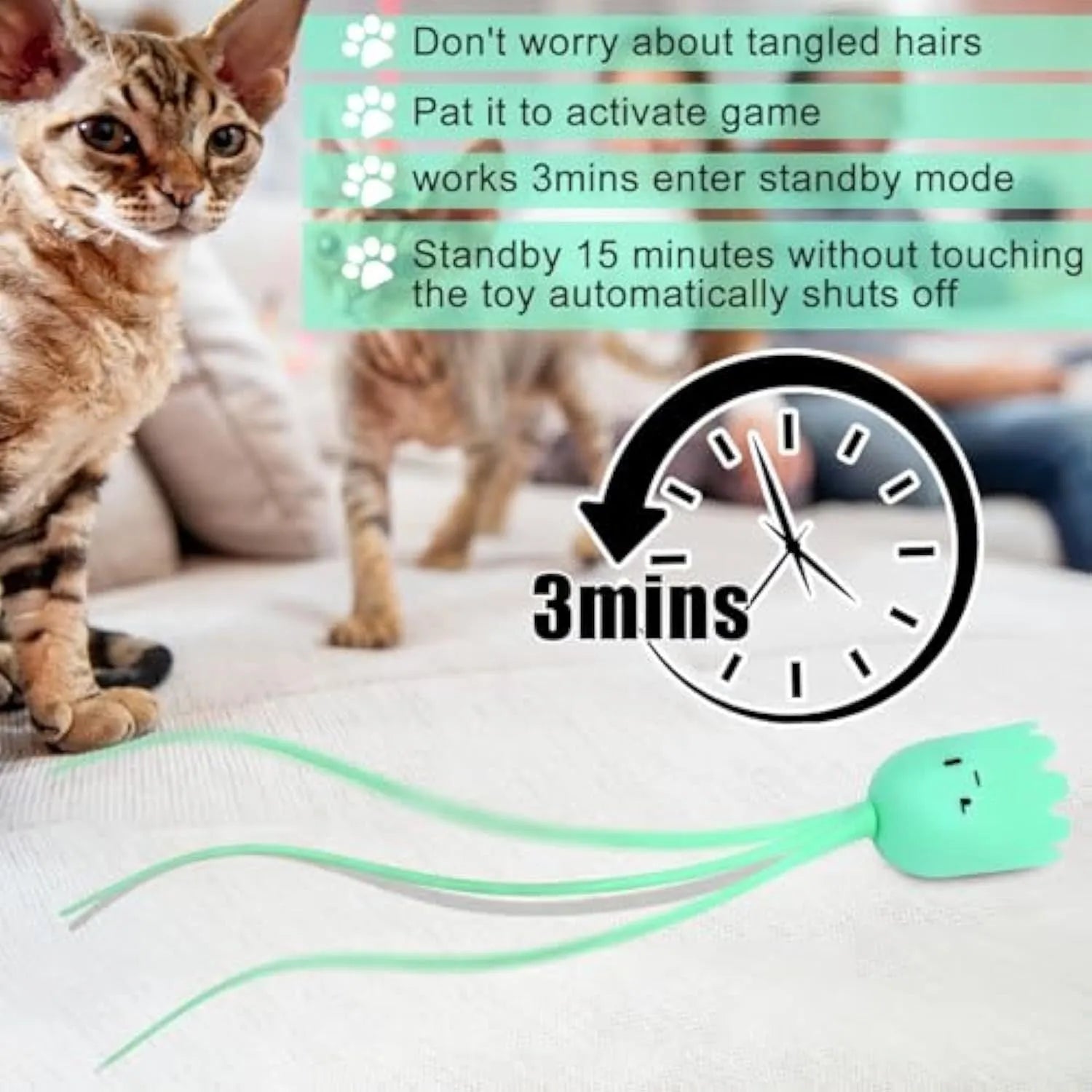 Green automatic cat toy with swinging silicone tails on a white surface