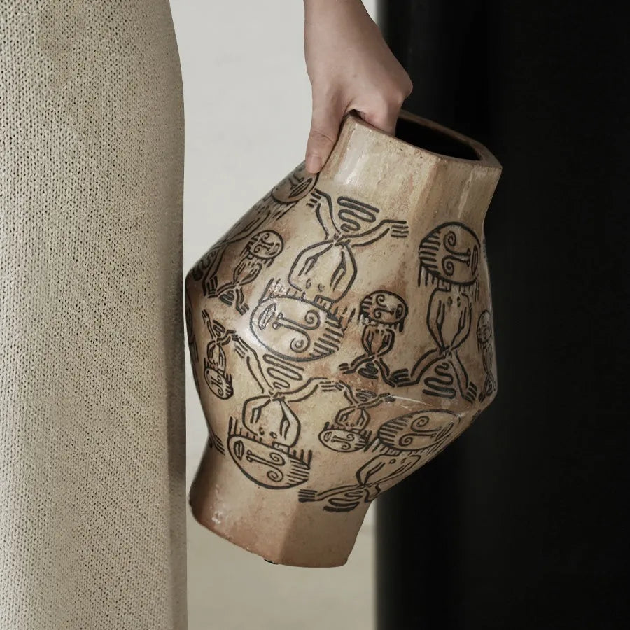 Hand-painted ceramic cylindrical vase with carved tribal totem vintage design.