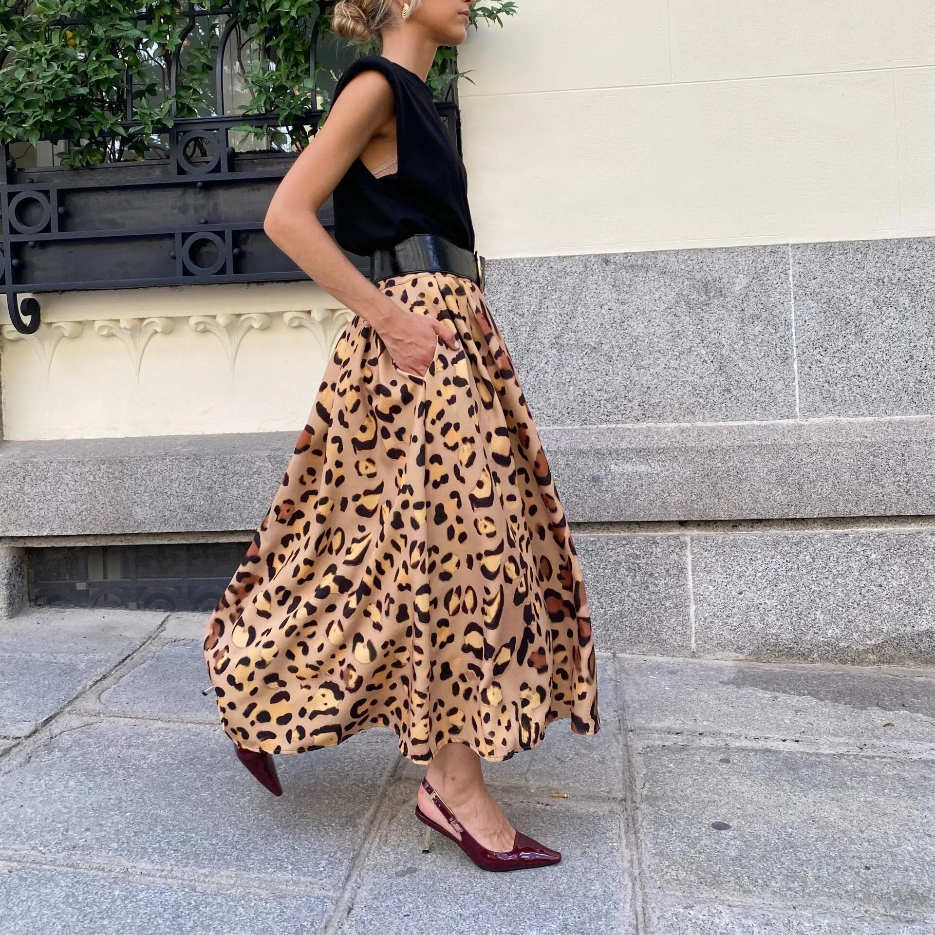 Brown leopard print women's A-line skirt with long length and big hem detail