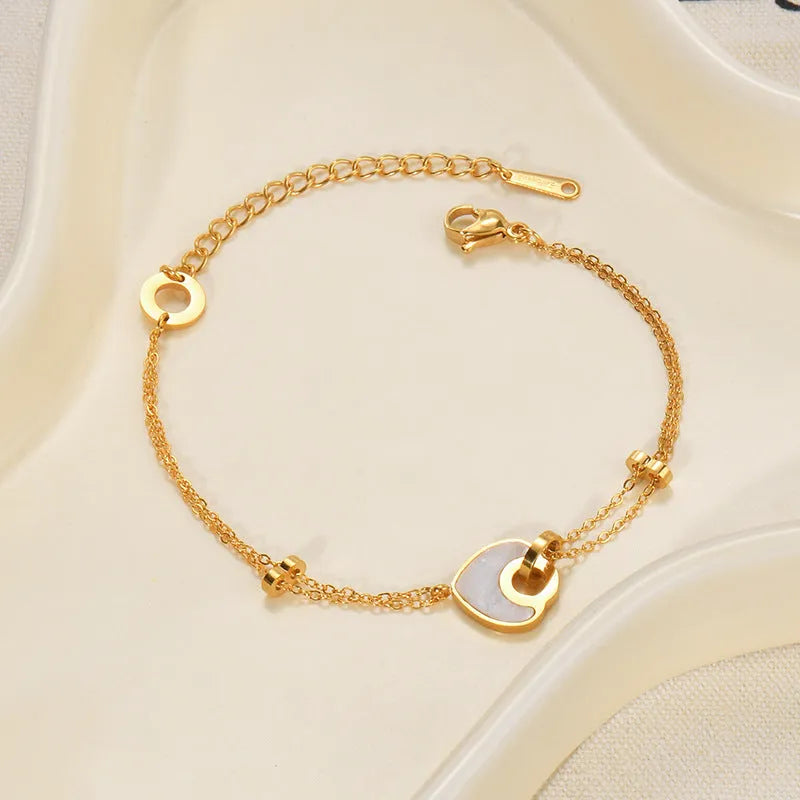 Women's stainless steel resin bracelet with double layered heart design in electroplated silver colour