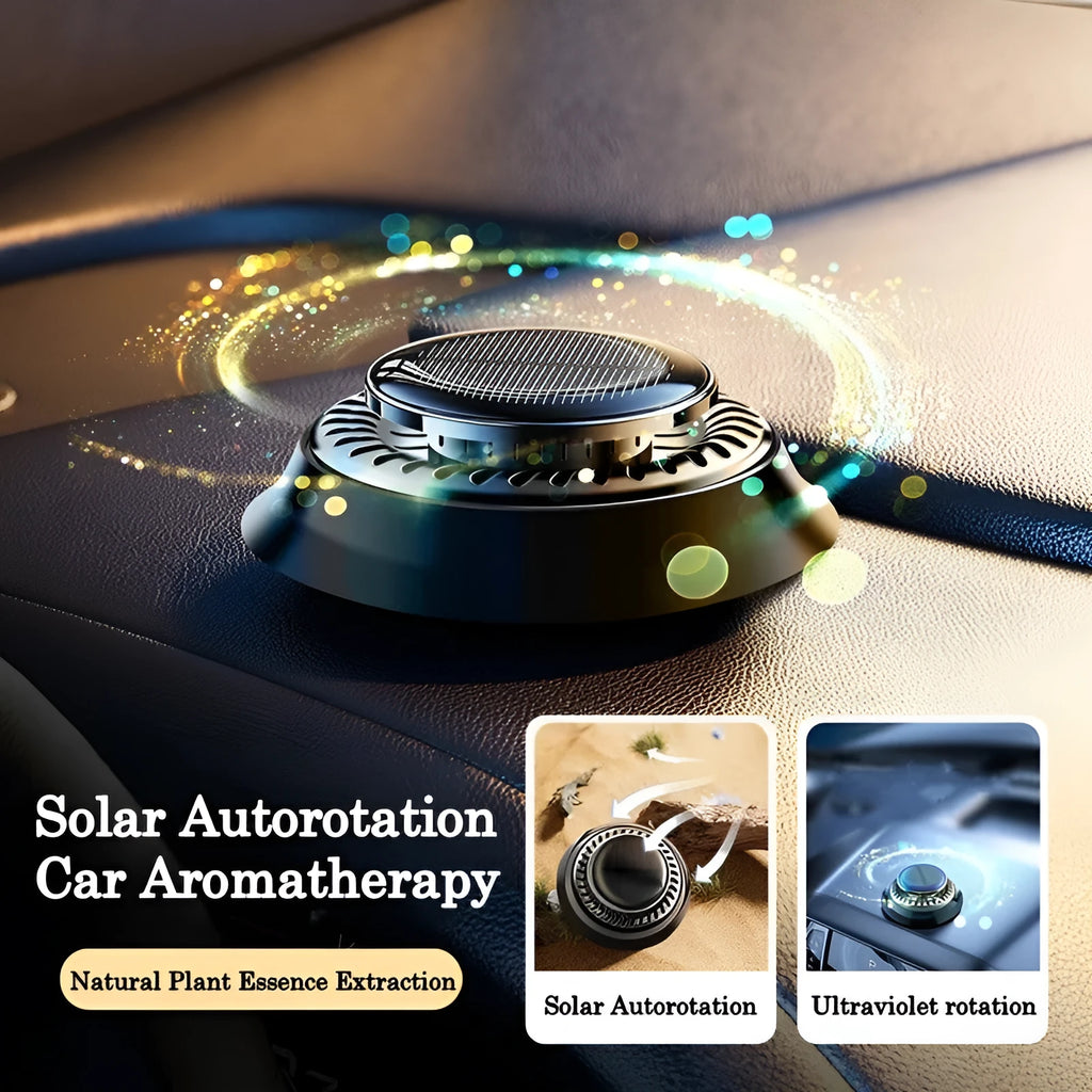 Black solar-powered kinetic double ring car air freshener diffuser on a car dashboard.