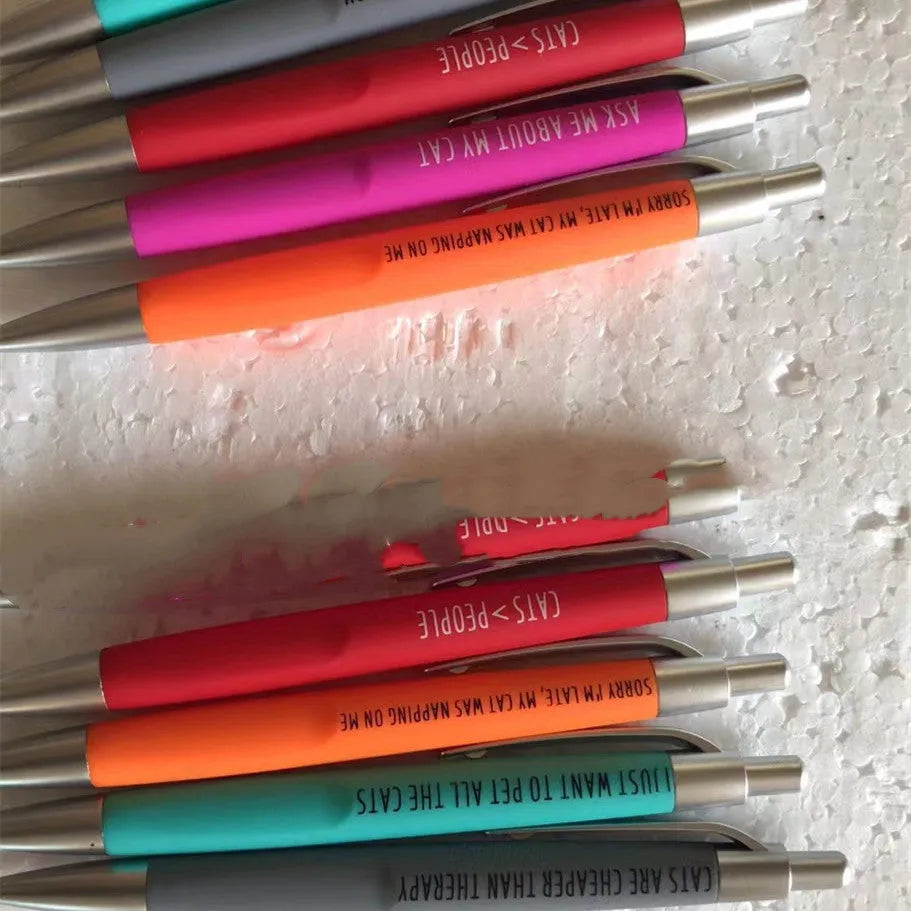 Set of five automatic push-button pens with a beaded fabric storage bag