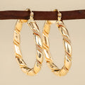 Geometric copper earrings for women in golden colour with ring and line design elements