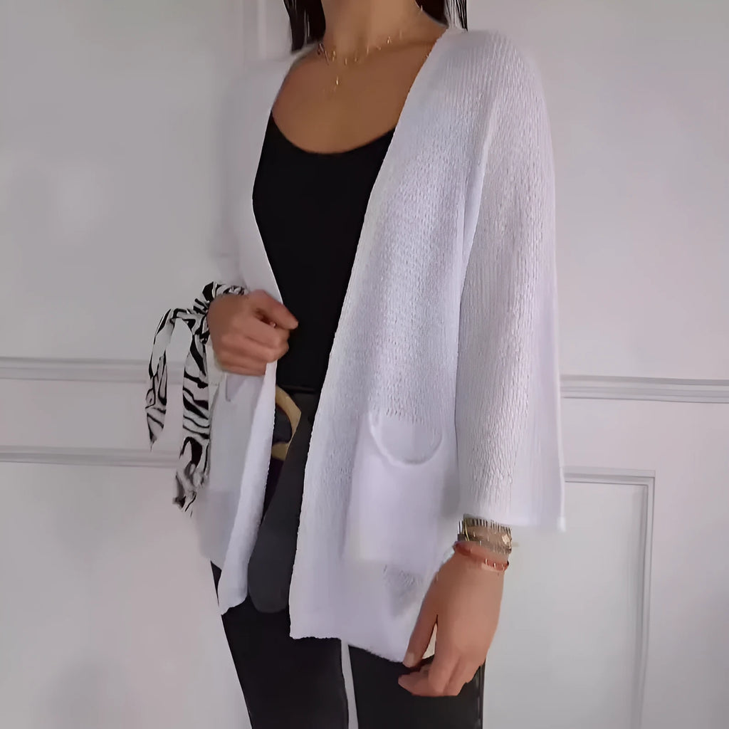 Women's army green waffle weave cardigan coat with nine-quarter length sleeves and pockets.