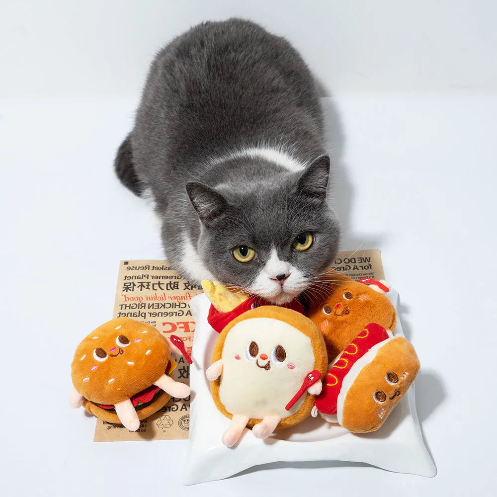 Assorted soft kitten teething toys shaped like a hamburger, chicken leg, fries, bread, and hot dog.