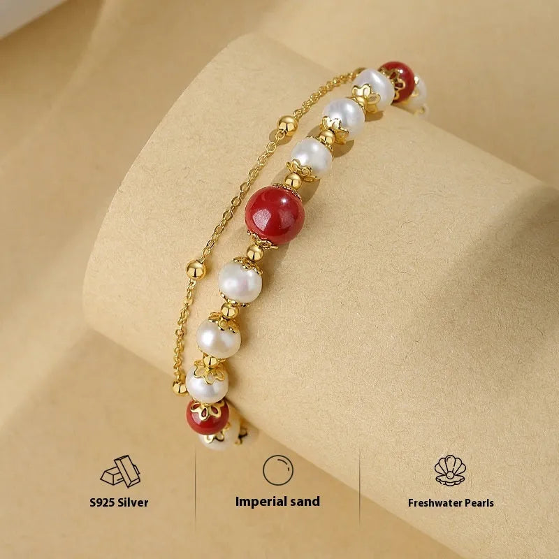 Sterling silver double-layer bracelet with cinnabar red bean and freshwater pearl geometric bean design