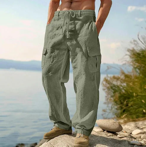 Men's loose cotton wide-leg casual trousers in light army green colour on a hanger.