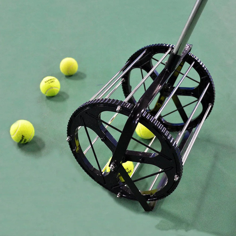 Black tennis ball picker basket made of nylon and metal on a court surface