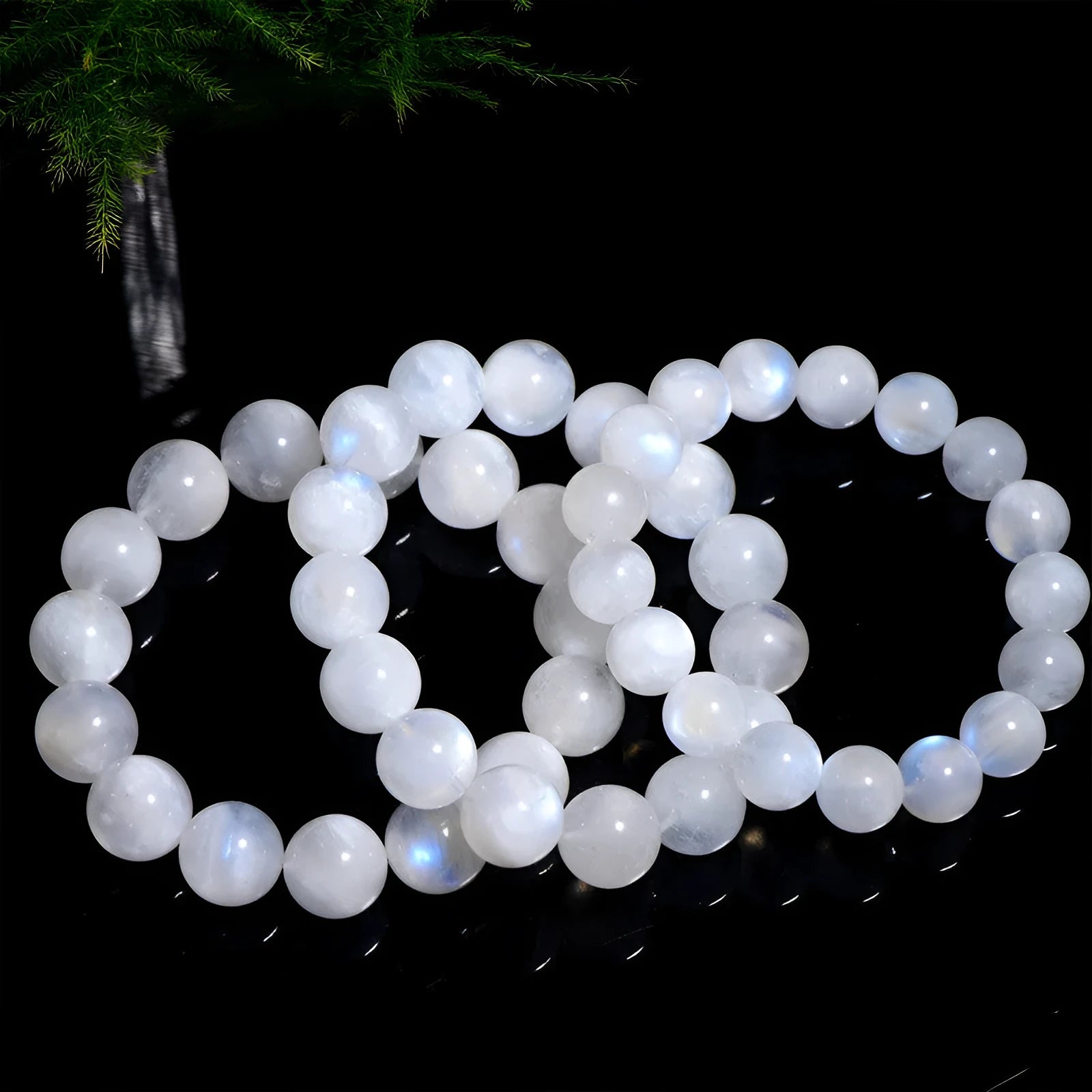 Natural blue moonlight round bead moonstone bracelet on wrist showing polished gemstone beads