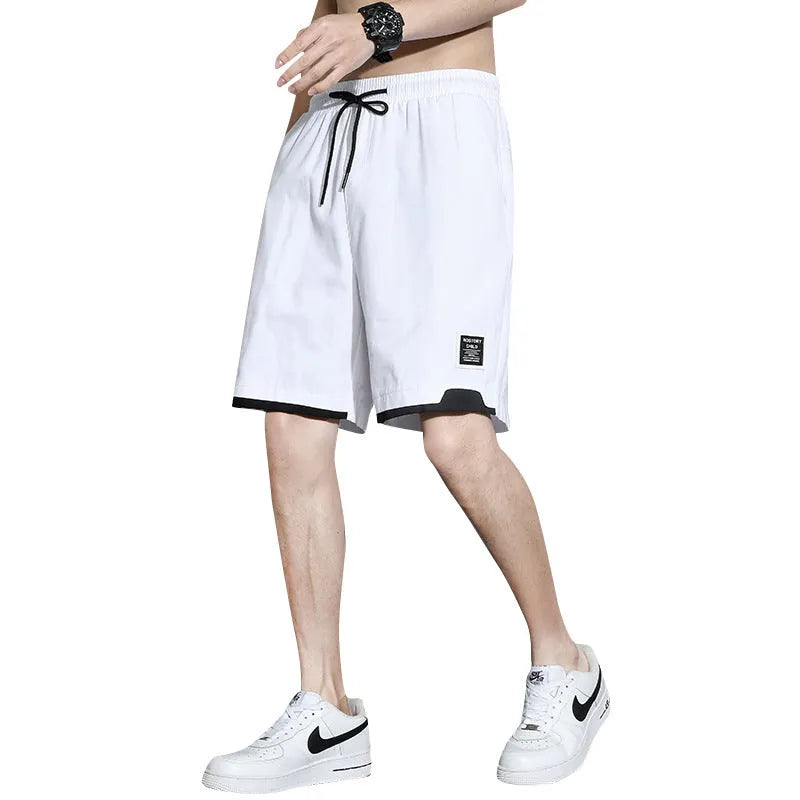 Boys cotton shorts in black, shown in a casual setting for summer.