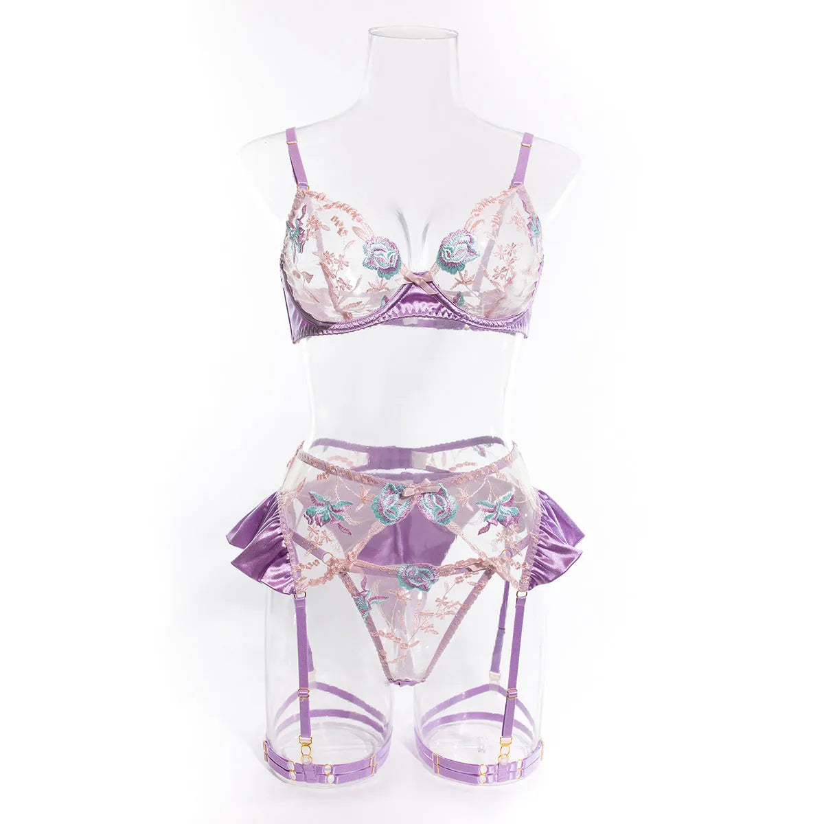 Light purple satin four-piece lingerie set with embroidery detail.