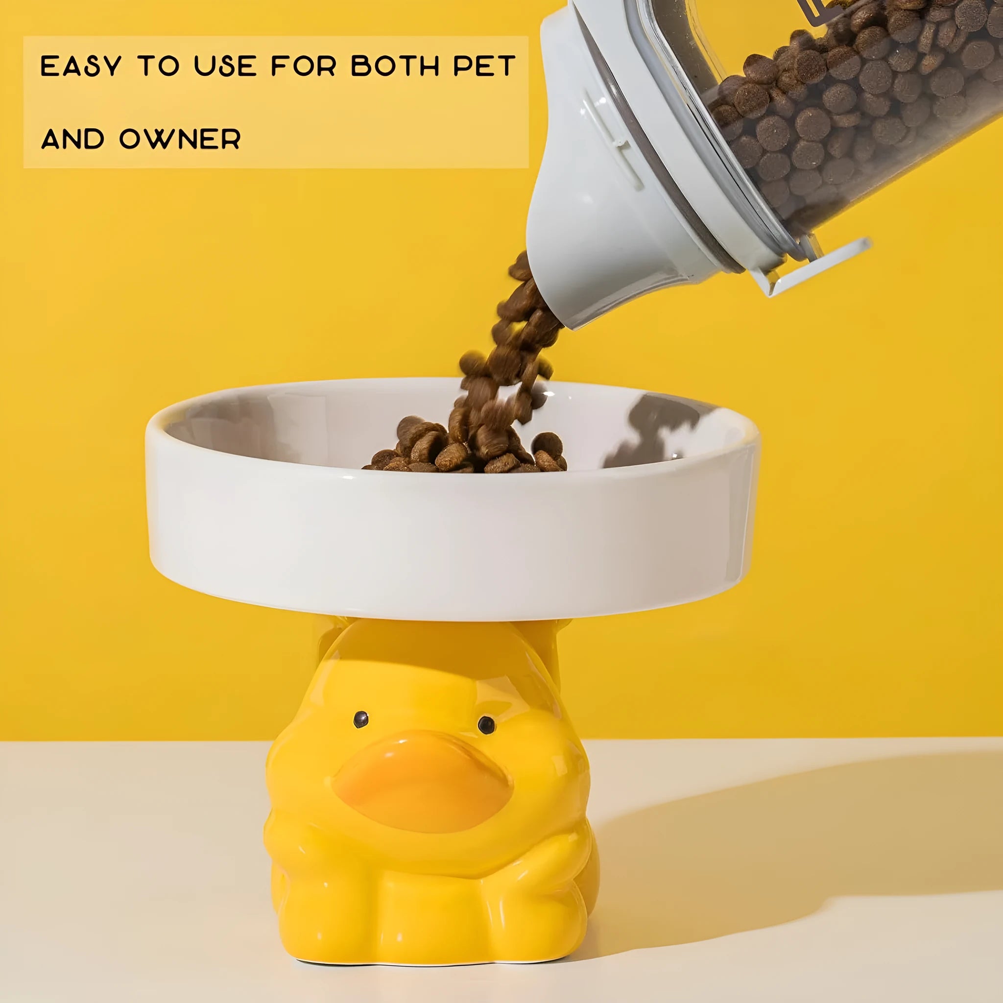 Raised ceramic cat bowl in animal design, showing elevated feeder stand and wide food bowl opening.