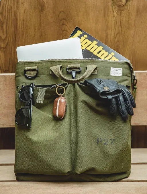 Marden Tooling medium canvas messenger bag in charcoal black with a shoulder strap and hard handle.