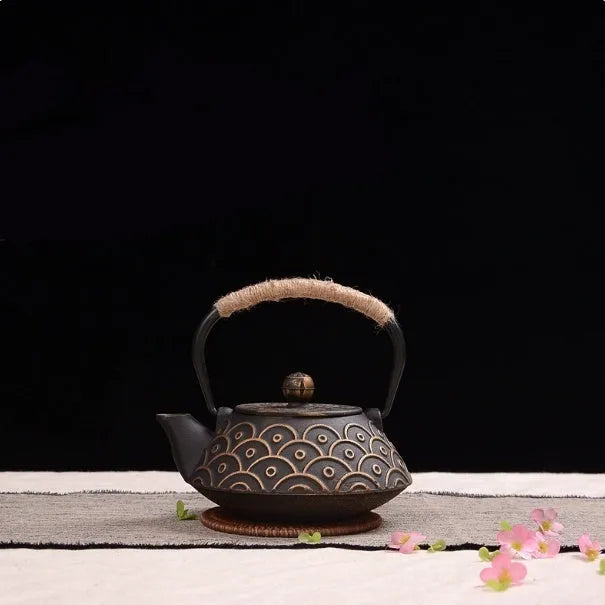 Japanese-style cast iron teapot with traditional decorative patterns and 0.9 litre capacity