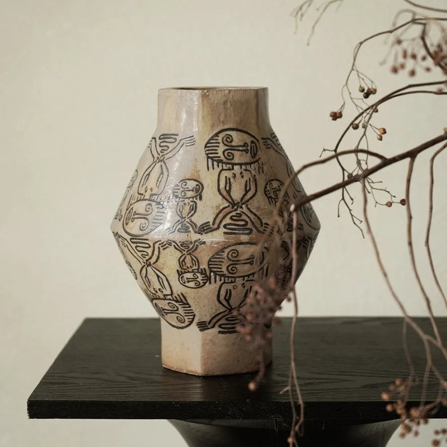 Hand-painted ceramic cylindrical vase with carved tribal totem vintage design.