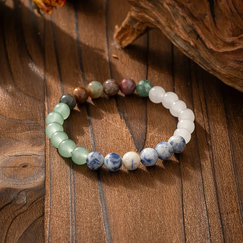 Vintage bohemian long necklace with geometric stone beads and tassel, shown with a matching shorter bracelet.