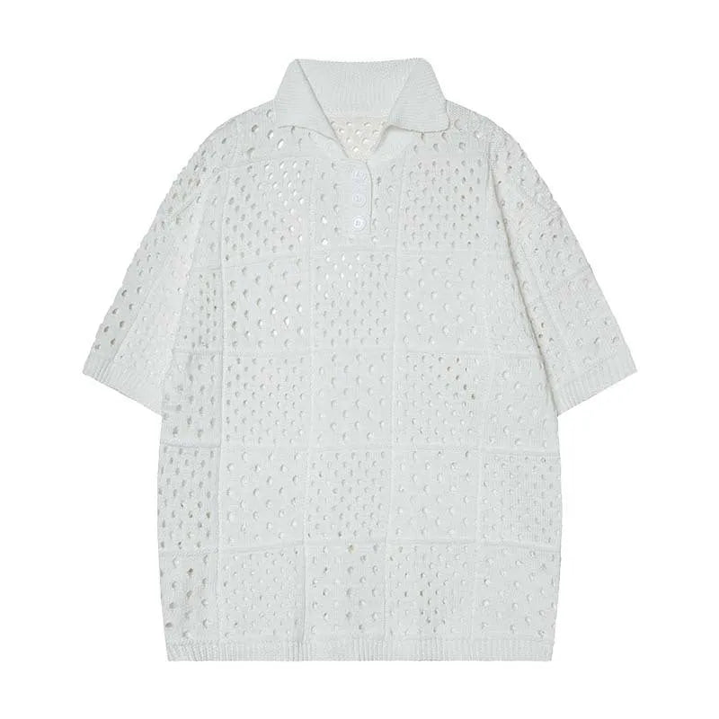 Teenager wearing a solid black loose-fit short-sleeved polo shirt with a hollow knitted texture.