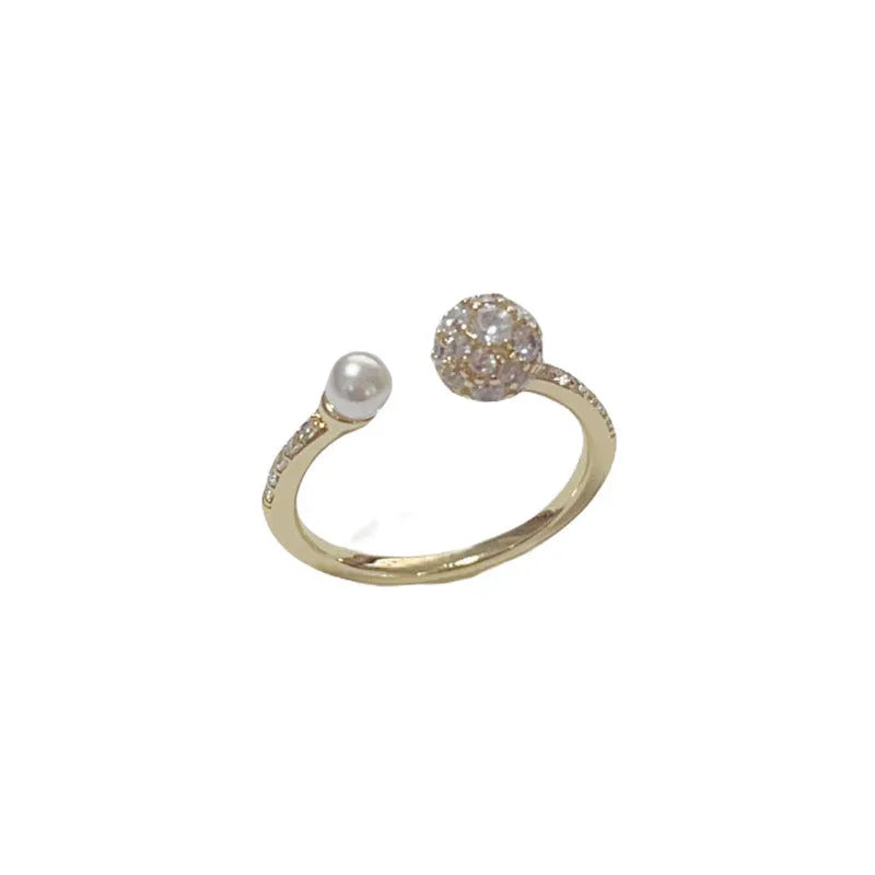 Gold and silver open-end women's ring with round zircon stones and pearl design on geometric band