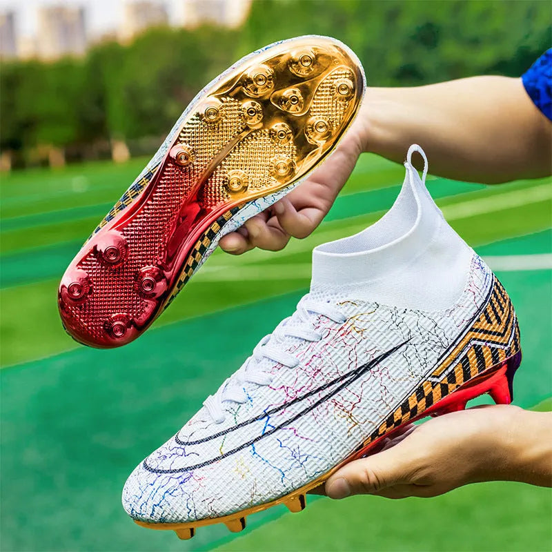 Men's high-top football training shoes with a gold-plated sole on an artificial grass surface