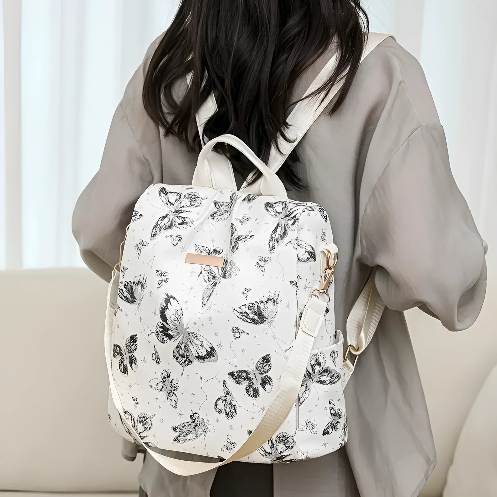 Butterfly printed large capacity backpack in multiple colours with sewing line detail
