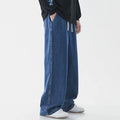 Mens fashion casual loose straight cotton denim jeans in retro light blue colour, full-length view