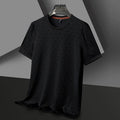 Man wearing a loose fit black round neck short sleeve T-shirt made from Ice Silk fabric.